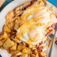 Compass · Thin sliced corn beef, sauerkraut, Swiss cheese, and topped with a house made aioli atop toa...