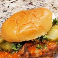 Nola'S Favorite Spicy Chicken Sandwich · Dressed with kale and classic oval pickles.