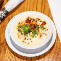 Queso Con Chorizo · Delicious queso blanco with a burst of flavorful chorizo (Mexican sausage) and a hint of jal...