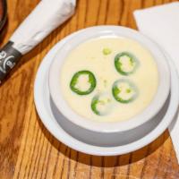 Cheese Dip · Delicious white queso dip with a hint of Jalapeños. tomatillos comes with chips and salsa