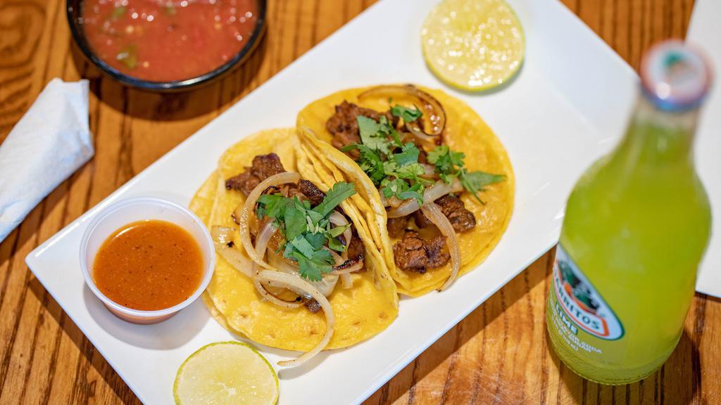 3 Al Carbon Tacos · Grilled skirt steak topped with caramelized onion cilantro and guajillo sauce.