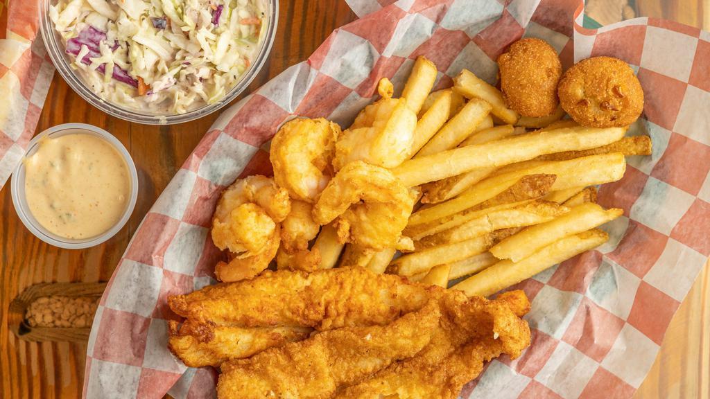 Shrimp & Catfish Basket · 6 jumbo shrimp and a quarter pound of fried catfish served with two hushpuppies and two sides of your choice