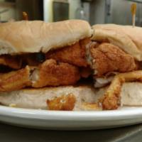 Flounder Basket · Three filets of fried flounder with two sides of your choice and two hush puppies
