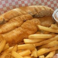 Catfish Basket · Three filets of fried catfish with two sides of your choice and two hush puppies