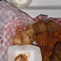 Oyster Basket · Ten fried oysters served with two hushpuppies and two sides of your choice