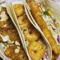 Fish Taco · Fried fish on a flour tortilla with slaw and Bubba's Sauce!