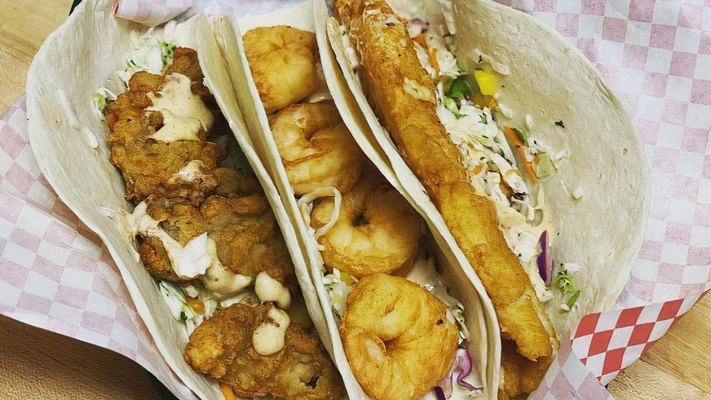 Fish Taco · Fried fish on a flour tortilla with house slaw and Bubba's Sauce!