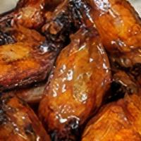 10 Smokehouse Wings · 10 smoked wings tossed in spicy chipotle citrus sauce & served with celery & blue cheese or ...