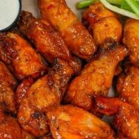 10 Wings · 10 crispy fried jumbo wings tossed in your favorite sauce with celery & blue cheese or ranch.
