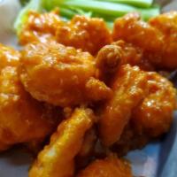 Buffalo Shrimp · A dozen fried shrimp tossed in your choice of sauce with celery & blue cheese or ranch.