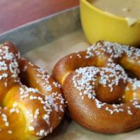 Pub Pretzels · Two delightful little pretzels with some tasty nacho cheese dip