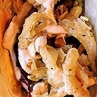Brisket Tacos · Chopped brisket with cabbage slaw, topped with onion strings, western BBQ sauce & chipotle r...