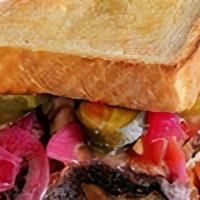 Son Of A Brisket Sandwich · Two pieces of Texas Toast stacked with house-smoked brisket drizzled with BBQ sauce, pickled...