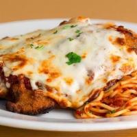 Chicken Parmigiana · Hand breaded chicken breast pan fried, baked with our marinara, and mozzarella. Served with ...