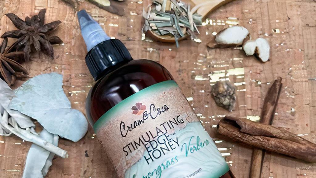 Lemongrass Verbena Stimulating Edge Honey · 4 fl oz/ 118 ml. Infused argan, castor, and black seed oil to help nourish and strengthen edges. Black tea is antioxidant-rich to help reduce hair shedding. Caffeine helps assist regrowth. Natural oils blend with ground roots and botanicals, stimulating camphor and mint oils to help reduce itchy scalp.

the rich oil helps assist hormonal shedding, hair loss, and thinning edges by improving blood circulation to the scalp, bringing more nutrients to the hair root to stimulate hair growth and strengthen hair follicles. It adds luster and sheen to both skin and hair.

directions massage honey on the hairline at least 3 times a week for optimal results. After applying, massage the treatment for at least one minute.

features:

antioxidant-rich black tea
nourishing organic argan oil
stimulating botanical blend 7 mint oils for a cool tingle
detoxifying bamboo charcoal for a healthy scalp
organic cold-pressed black seed oil is rich in thymoquinone, which works wonders on the scalp, aiding in the natural production of your scalps’ oils, aids in the irritation and itchiness of your scalp, and causes regrowth in thinning parts of the scalp