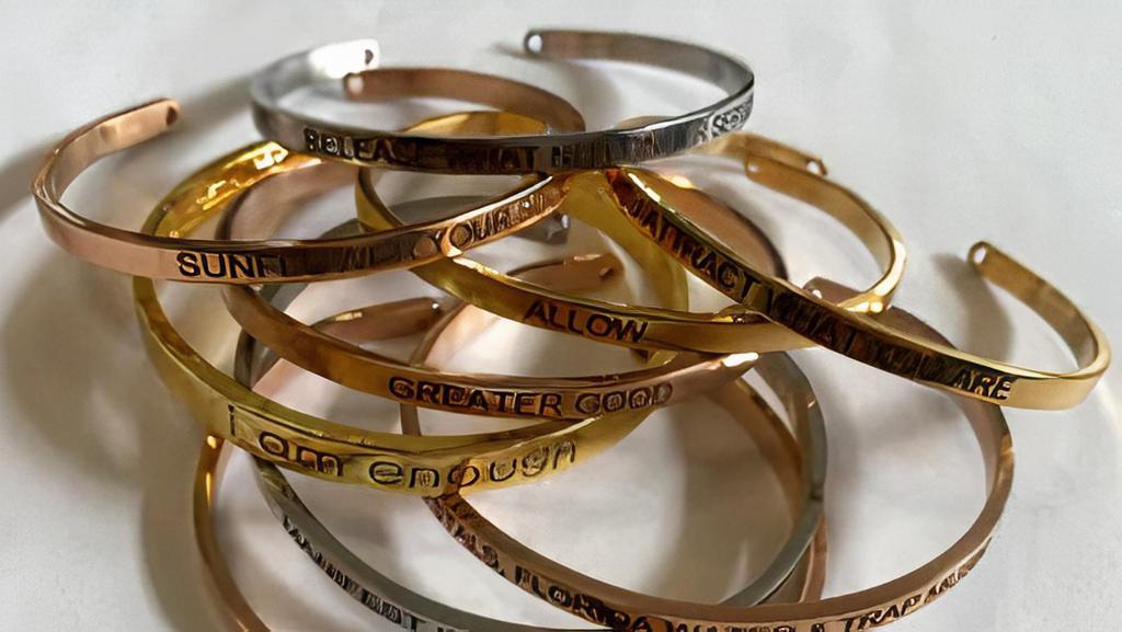 Affirmation Cuff · Affirm, manifest, believe. Embrace and remind yourself daily with affirmation cuffs. Stack them together or wear alone for gentle reminders. Cuffs are fully adjustable to fit any wrist size and come in Silver, Gold & Rose Gold.