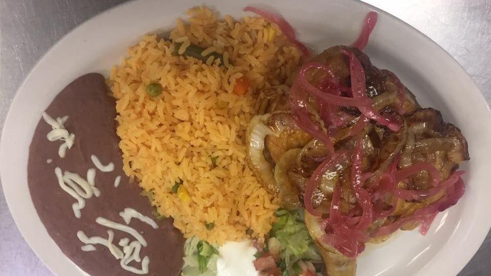 Pork Carnitas · Morsels of marinated fresh pork, fried until crisp on the outside, tender on the inside, and topped with grilled onions. Served with rice, beans, and salad.