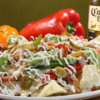Nacho Supreme · Grilled and seasoned your choice chicken, steak, or ground beef cooked with bell peppers and...