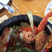 Fajita Mixta · Steak, chicken, shrimp, and chorizo. Fajitas cooked with onions, bell peppers, and tomatoes....