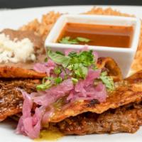 Quesabirria · Two soft corn quesadillas filled with mole-glazed beef short rib and Chihuahua cheese. Serve...