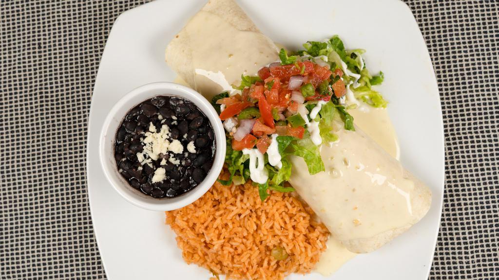 Cali Chicken · Stuffed with grilled chicken, rice, refried or black beans. Topped with queso, lettuce, sour cream and pico de gallo.