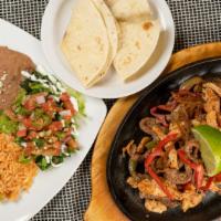 Fajitas (Lunch) · Grilled meat of your choice with bell peppers and onions. Served with lettuce, sour cream an...