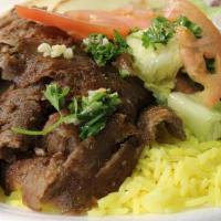Gyros Plate · Lamb and beef or chicken come with rice and salad tsaziki sauces on the side