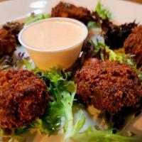 Mini Crab Poppers · Mini crab cakes with cheese and jalapenos.