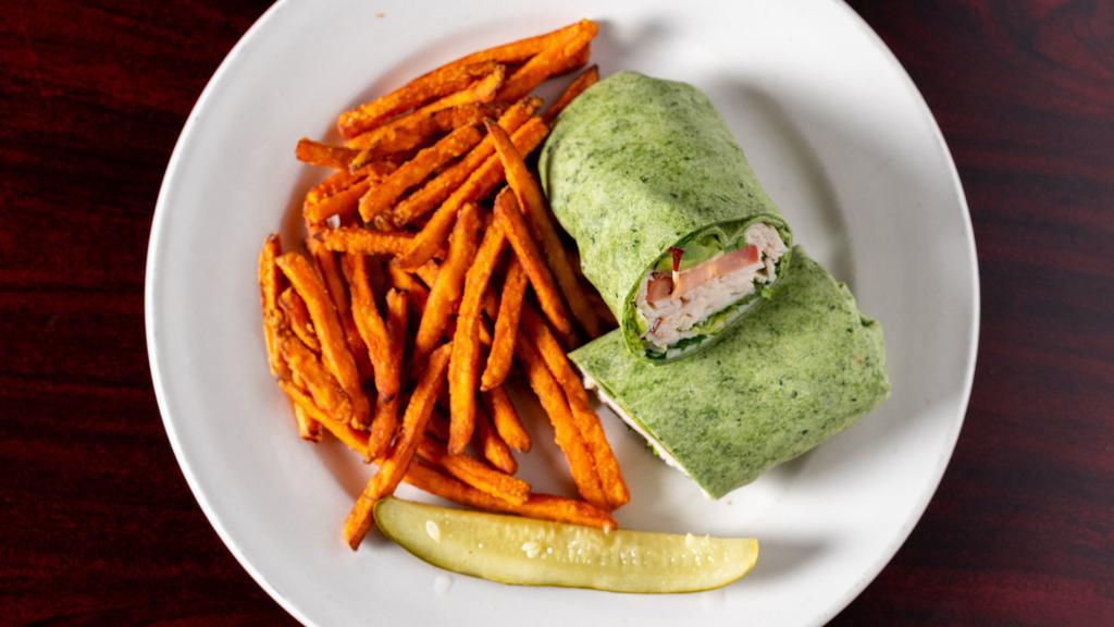 Turkey Avocado Wrap · Our sliced turkey breast, with bacon, Swiss, lettuce, tomatoes, sliced avocado and ranch dressing in a soft tortilla wrap.
