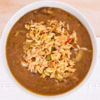 Chicken & Sausage Gumbo · Our roux based gumbo with chicken and andouille sausage, slow cooked and served with seasone...