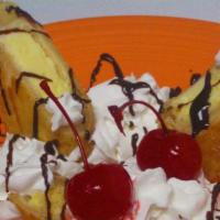 Cheesecake Chimichanga · Velvety cheesecake wrapped in a crispy flour tortilla and fried until golden brown. Topped w...