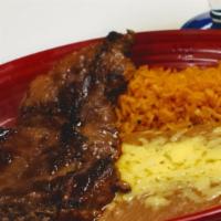 El Potrillo Favorito · Juicy rib-eye steak, served with rice, beans, and tortillas. With your choice of guacamole s...