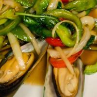 Butter Mussel · Mussels stir-fried in butter with fresh garlic,  onions, bell pepper and fresh basil.