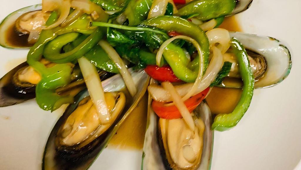 Butter Mussel · Mussels stir-fried in butter with fresh garlic,  onions, bell pepper and fresh basil.
