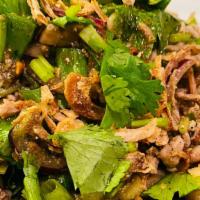 Larb · Ground meat mixed with red onion, mint leaves, green onion, cilantro and rice powder.