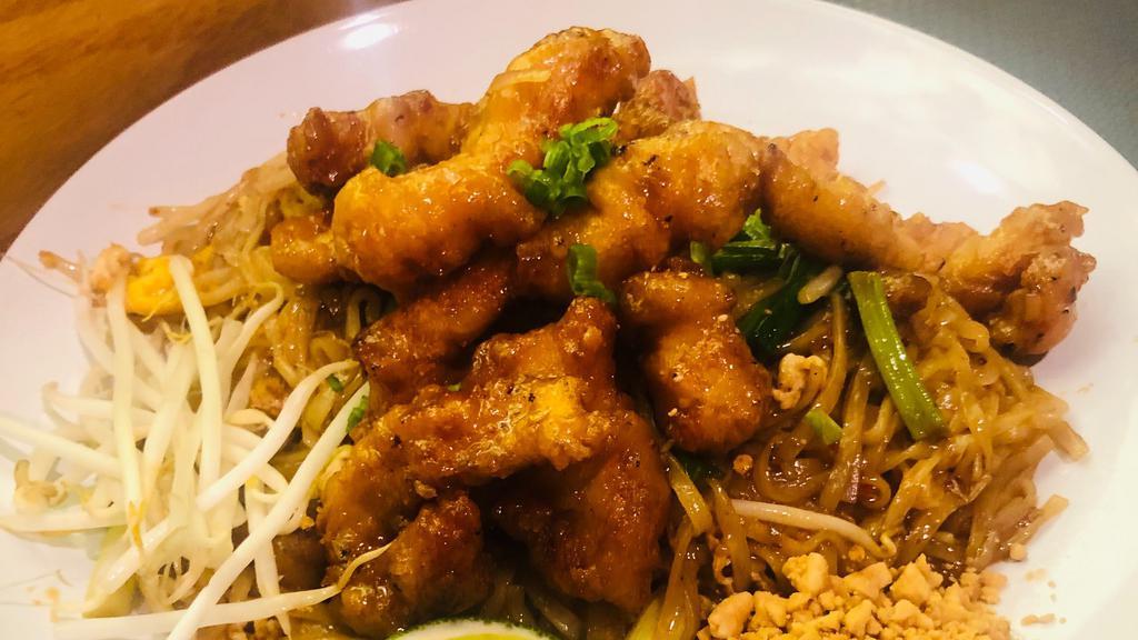 Pad Thai Crispy Chicken  · Deep Fried Crunchy Chicken in Pad Thai Sauce with Rice Noodles, Egg, Bean Sprouts, Green Onions, & Crushed Peanuts on top.