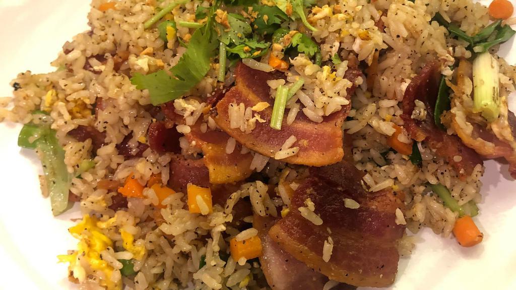 Bacon Fried Rice · Thai fried rice with egg, pea, carrots, bacon, green onion and cilantro.