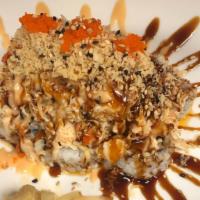 Volcano Roll (Baked) · Spicy crab, white fish, shrimp, masago and tempura flakes.