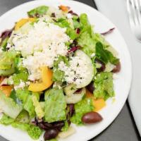 Greek Salad · Spring mix, feta, banana peppers, kalamata olives, tomatoes, cucumber, with Greek dressing.