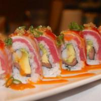 Cruise Roll · Smoked salmon, crabmeat, avocado inside, topped with seared tuna, tobiko, scallions, and spi...