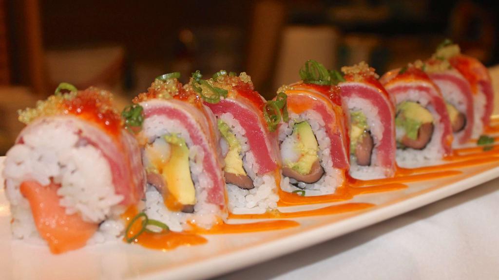 Cruise Roll · Smoked salmon, crabmeat, avocado inside, topped with seared tuna, tobiko, scallions, and spicy mayo.