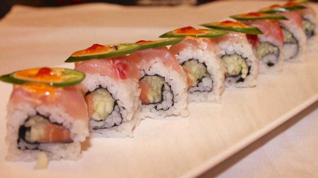 Tiger Roll · Salmon, cucumber, Japanese mayo inside, topped with yellowtail, jalapeño.