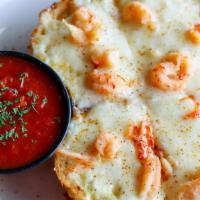 Crawfish Bread · French bread topped with Alfredo sauce, crawfish tails and Mozzarella.