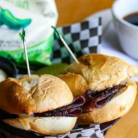 The Classic French Dip · Fresh sliced angus roast beef and swiss with a side of au jus and creamy horseradish sauce f...