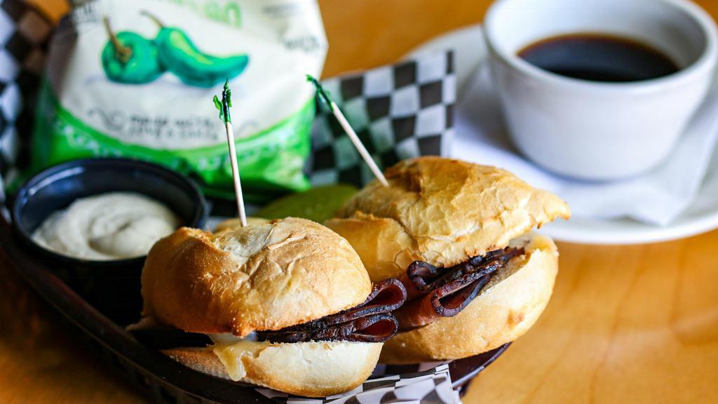 The Classic French Dip · Fresh sliced angus roast beef and swiss with a side of au jus and creamy horseradish sauce for dippin'. sautéed onions available upon request.