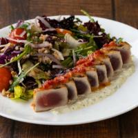 Grilled Yellowfin Tuna · Farro, cherry tomatoes, red onion, mixed greens, chili vinaigrette, olive remoulade.