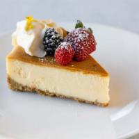 Lemon Mascarpone Cheesecake · Fresh berries, whipped cream