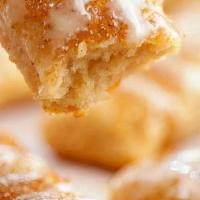 Cinnamon Breadsticks · Hand-stretched dough topped with butter cinnamon sugar and icing.