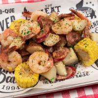 Famous Cajun Shrimp Boil · Tender, succulent boiled Shrimp and fresh Red Potatoes tossed with grilled Sausage and Corn,...