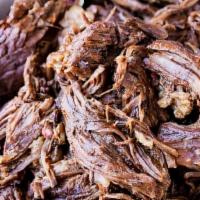 Barbacoa (Marinated Beef) · Braised brisket | onions and cilantro.